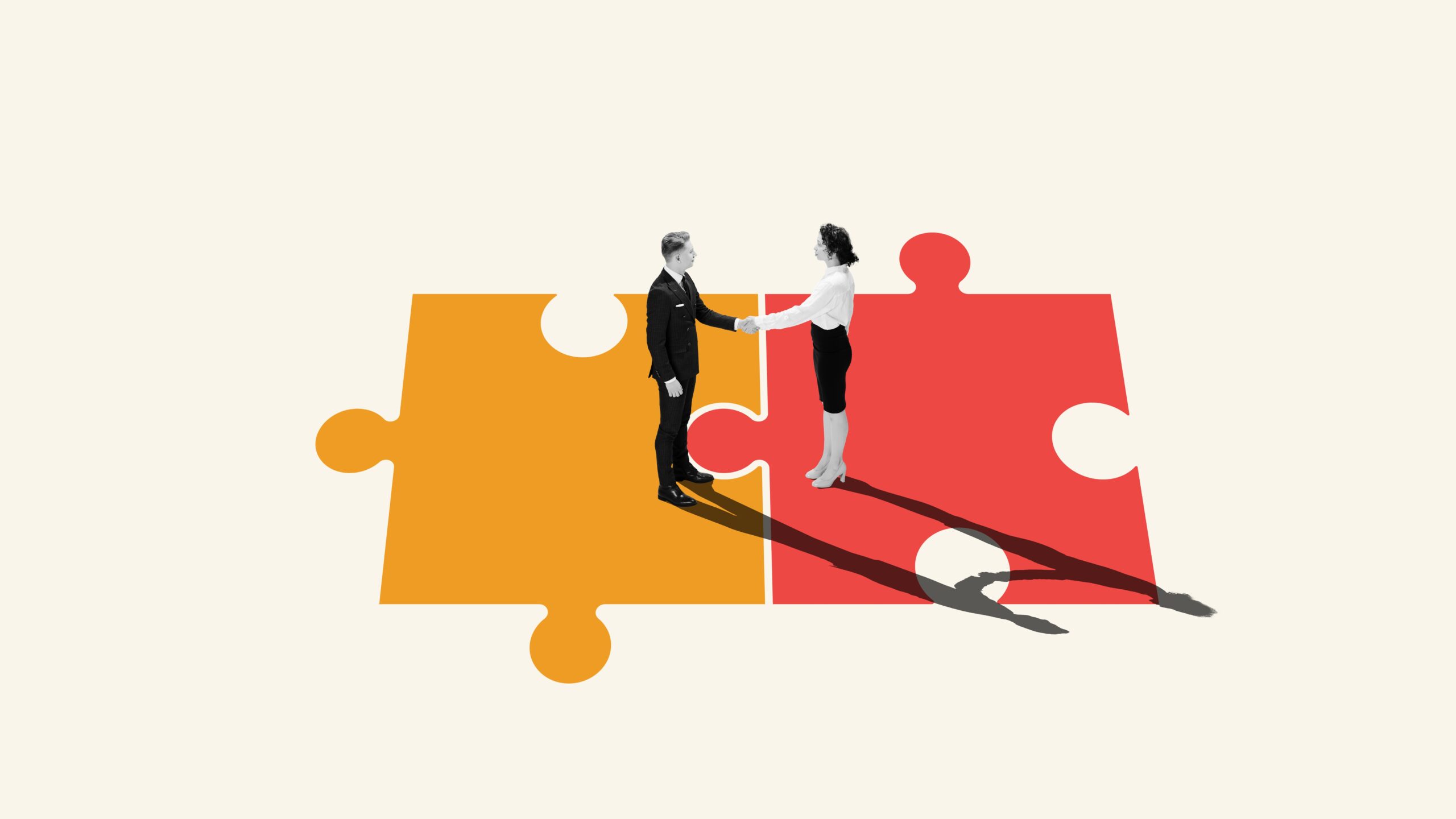 People on jigsaw pieces shaking hands
